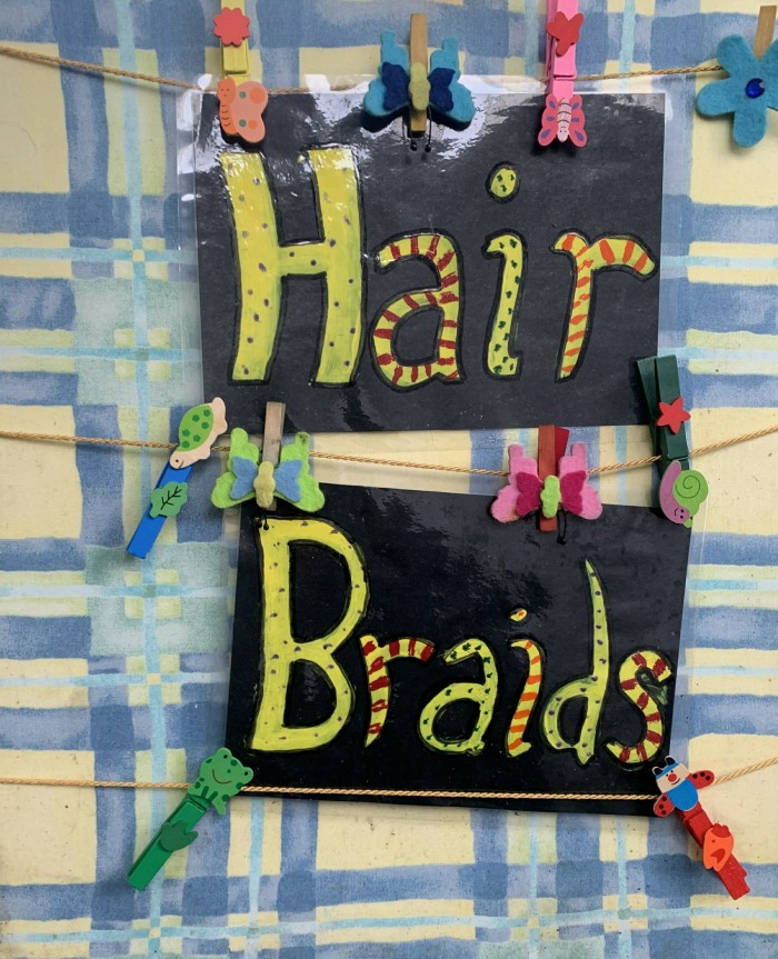 Hair braiding sign